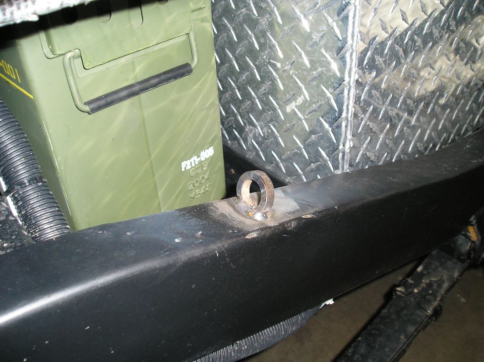 Welded ring tab on black tube bumper with green ammo can behind