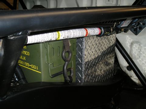 1986 Toyota Hilux - Storage area inside a vehicle, an ammo can, a jack, and a diamond plate box.