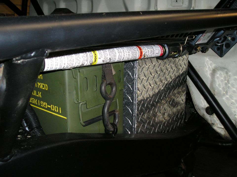 Interior storage with ammo can, jack, and diamond plate box