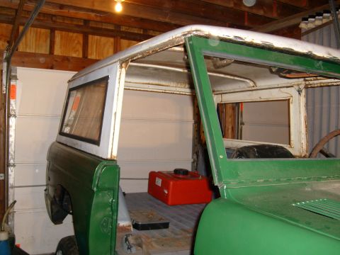 1974 Ford Bronco - This 1974 Ford Bronco is undergoing restoration in a garage, with its doors and roof removed.