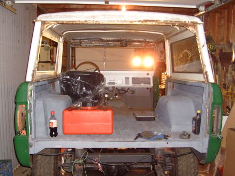 1974 Ford Bronco - Rear view of a 1974 Ford Bronco's interior, showing the cargo area and dashboard.