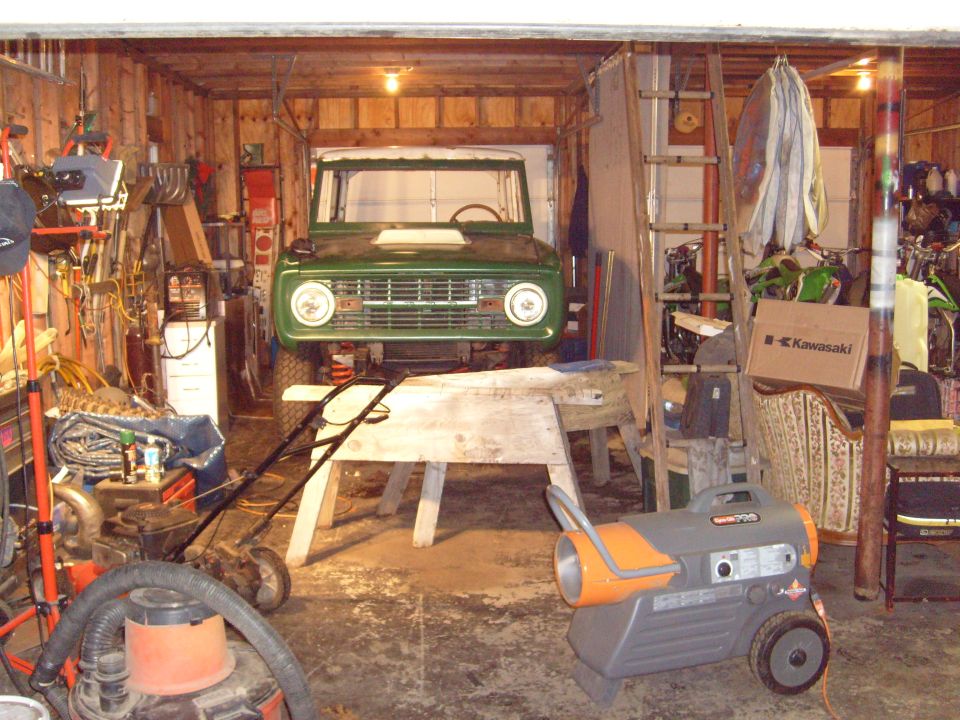 Green 1974 Ford Bronco front view in garage