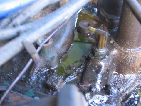 1978 Jeep Cherokee - Engine part showing a leak of green fluid, possibly coolant.