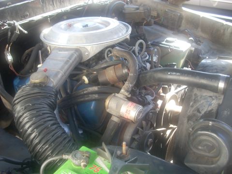 1992 Ford Bronco - Close-up view of a vehicle's engine compartment, showing various components and wiring.
