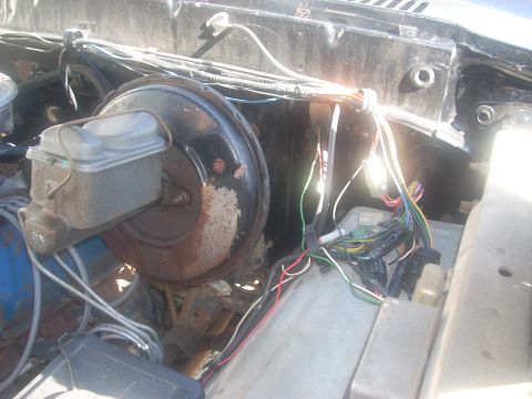 1992 Ford Bronco - Close-up view of the brake booster and master cylinder assembly in an engine bay.
