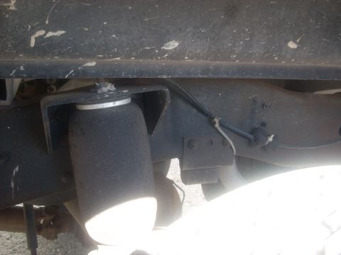 1992 Ford Bronco - Vehicle frame with an air suspension component visible.