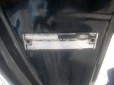 1992 Ford Bronco - A VIN plate is shown, with the Ford logo clearly visible.
