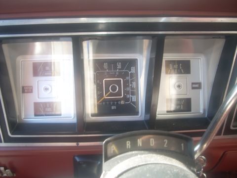 1992 Ford Bronco - Interior view of a vehicle's dashboard gauges, including a speedometer and warning lights.