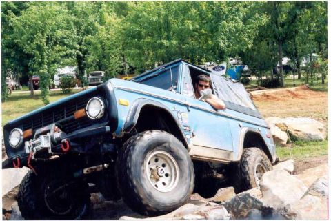 1976 Ford Bronco - This blue 1976 Ford Bronco is shown tackling a challenging rocky obstacle course.