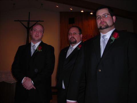 1984 Ford Bronco - Three men in formal attire pose for a photograph in what appears to be a church or chapel.