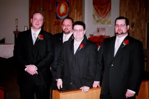 1984 Ford Bronco - Four men dressed in formal attire stand together, likely for a wedding ceremony.