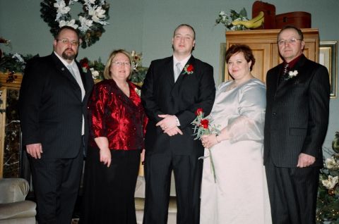 1984 Ford Bronco - A wedding party poses for a photograph in a decorated room.