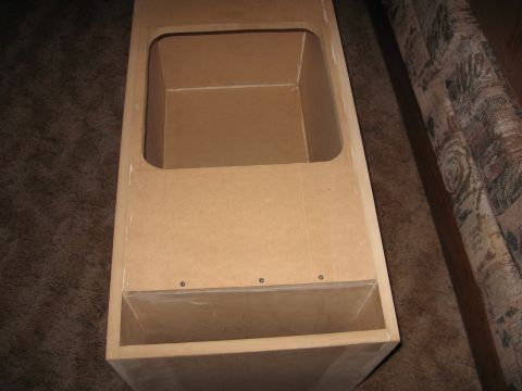 1992 Ford Crown Victoria - This is an unfinished MDF speaker box, likely for a custom car audio installation.