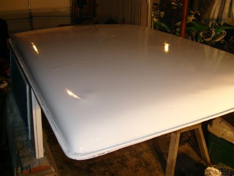 1974 Ford Bronco - A white car roof, possibly undergoing restoration, is shown in a garage setting.