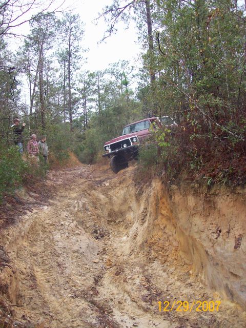 1978 Ford Bronco - This vehicle navigates a challenging off-road path, with onlookers observing the descent.