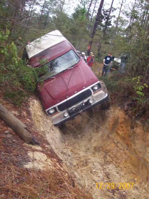 1978 Ford Bronco - This vehicle appears to be a Ford Bronco from the early 1980s, stuck off-road with a winch line attached.