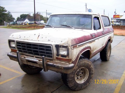 1978 Ford Bronco - This 1978 Ford Bronco is shown in a front 3/4 view, a white body with maroon accents.