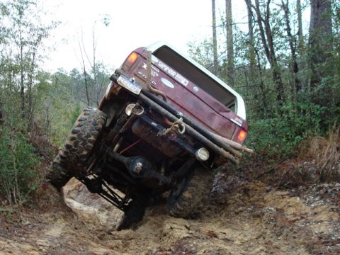 1978 Ford Bronco - This 1978 Ford Bronco is deep in the mud, showing its rear end as it struggles to gain traction.
