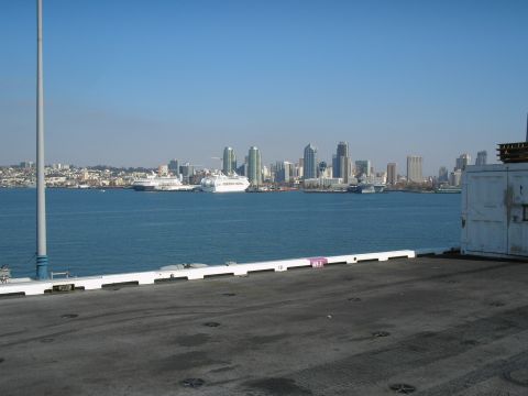 1989 Ford F-250 - A wide shot of the San Diego harbor with the city skyline in the background and cruise ships on the water.