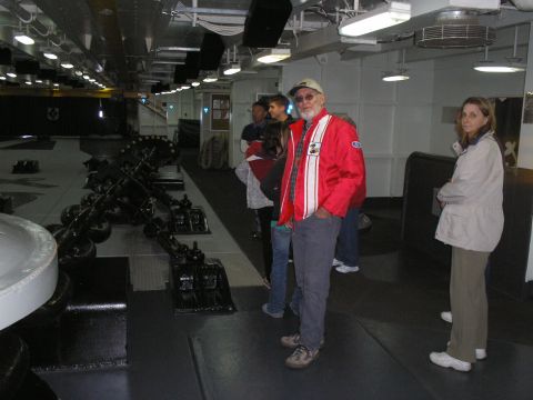 1989 Ford F-250 - Tourists observe equipment in a ship's interior, possibly a museum or historical vessel.