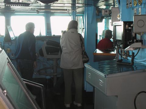 1989 Ford F-250 - View from inside a ship's bridge, showing crew members and navigation equipment.