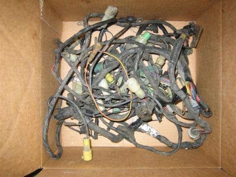 1987 Suzuki Samurai - A messy vehicle wiring harness is piled inside a cardboard box, showing many wires and connectors.