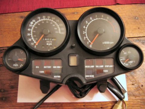 1985 Ford LTD Crown Victoria - Motorcycle instrument cluster shows speedometer, tachometer, fuel, oil temp, and indicator lights.