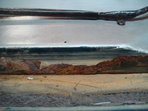 1996 Ford Bronco - Significant rust and corrosion are visible along the door jam, indicating a need for repair.
