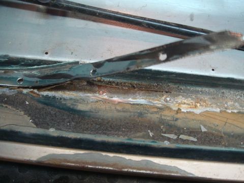 1996 Ford Bronco - Door jamb shows significant rust and damage, indicating a need for repair.