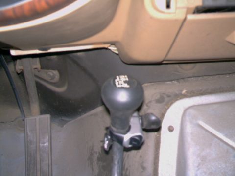 1989 Ford Bronco - Interior shot focusing on the gear shifter and surrounding components.