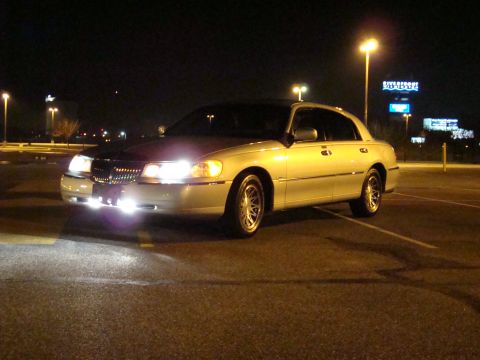 2002 Lincoln Town Car - This 2002 Lincoln Town Car is parked in a lot at night under streetlights.