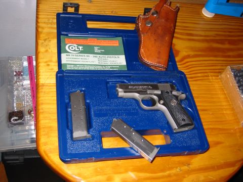 1996 Ford Bronco - Colt MK IV Series 80 pistol, magazines, and holster are neatly arranged in a blue carrying case.