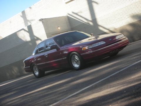1992 Ford Crown Victoria - Maroon 1992 Ford Crown Victoria parked outside on a sunny day.