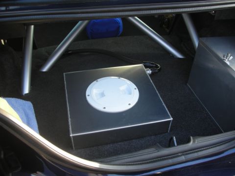 1998 Ford Crown Victoria - The trunk interior shows a custom fuel cell and roll cage, suggesting performance modifications.