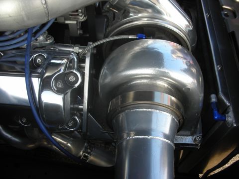 1998 Ford Crown Victoria - Custom engine modifications are visible in this close-up shot of a turbocharger and associated plumbing.