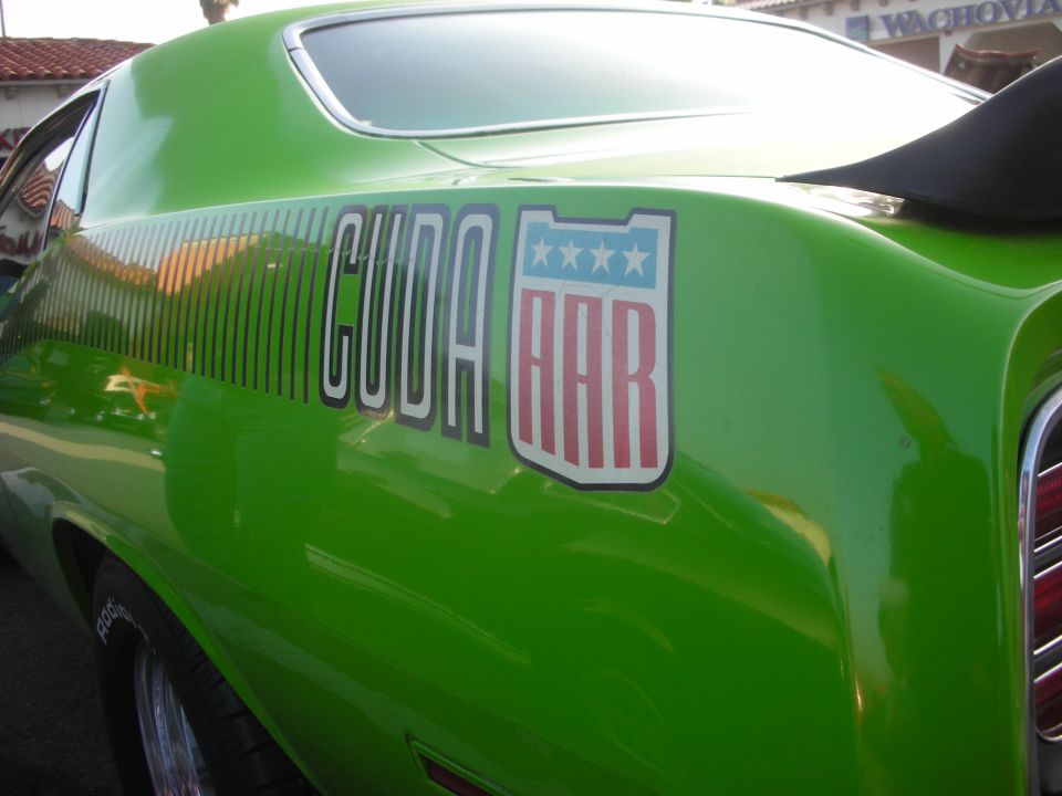 Green car quarter panel with CUDA AAR graphic and shield decal