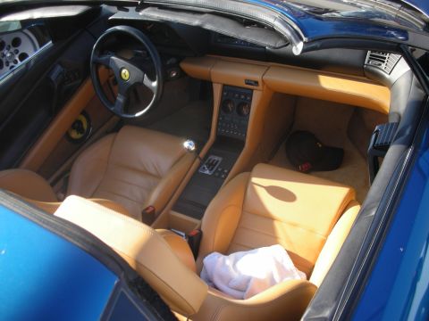 1998 Ford Crown Victoria - Interior view of a tan leather sports car cabin, showing seats and dashboard details.