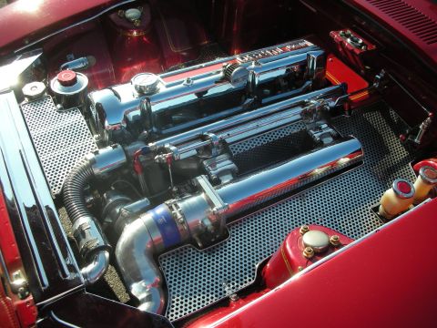 1998 Ford Crown Victoria - A highly customized engine bay with extensive chrome detailing and performance modifications is shown.
