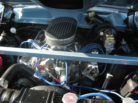 1998 Ford Crown Victoria - Close-up view of a modified engine bay, custom hoses and wiring.