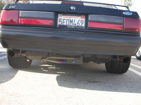 1998 Ford Crown Victoria - This 1998 Ford Mustang displays its rear end, custom exhaust components and a California license plate.