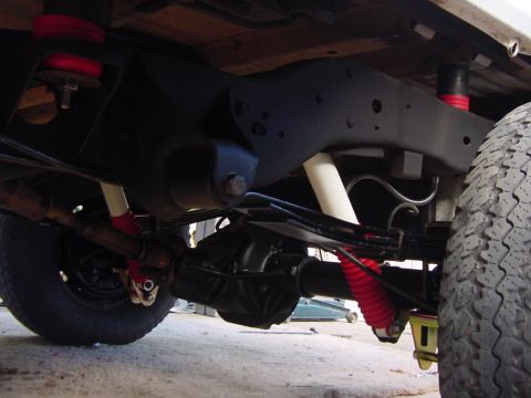 1992 Ford Bronco - Close-up view of the suspension system on a 1992 Ford Bronco, highlighting aftermarket modifications.