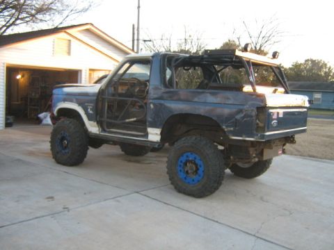 1986 Ford Bronco - This modified 1986 Ford Bronco features a full roll cage, oversized tires, and a custom exterior.