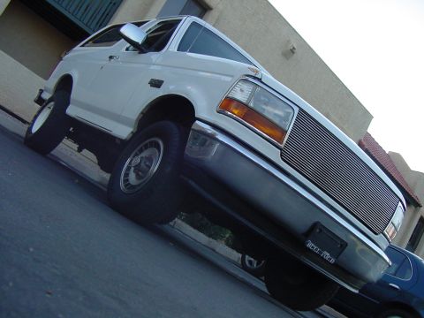 1992 Ford Bronco - This 1992 Ford Bronco features a distinctive chrome grille and a 3/4 front view.
