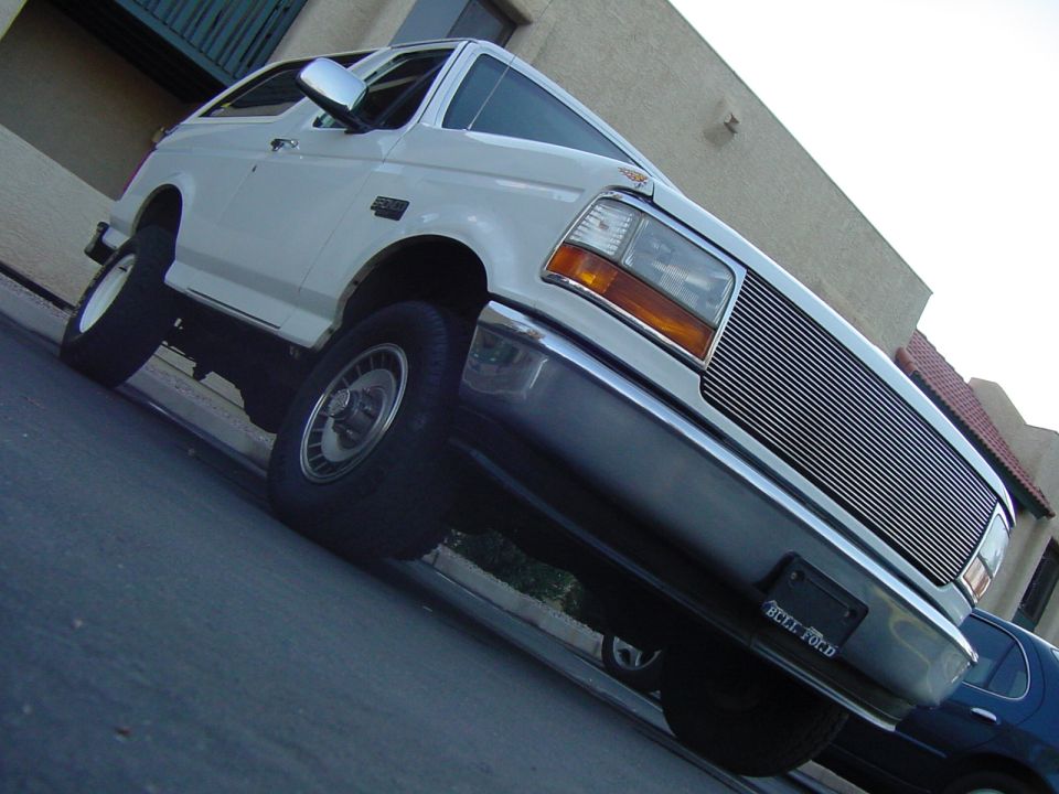 White 1992 Ford Bronco 3/4 front view with chrome grille