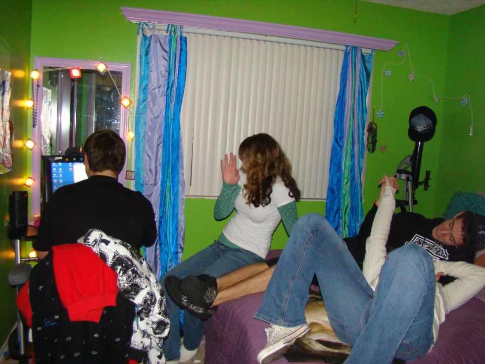People gathered in a brightly lit green room