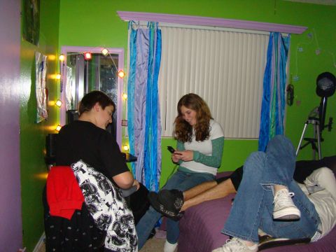 1989 Ford Bronco - Friends hang out in a brightly decorated bedroom, each engrossed in their mobile devices.
