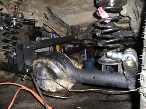 1986 Ford Bronco II - Custom suspension modifications are visible on the rear axle of an off-road vehicle.