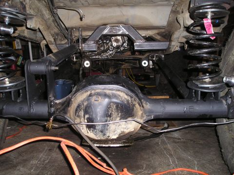 1986 Ford Bronco II - Custom suspension linkage and rear axle assembly are visible in this underside view.