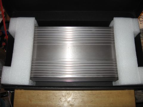 1992 Ford Crown Victoria - Car amplifier packed in foam inside a black box.