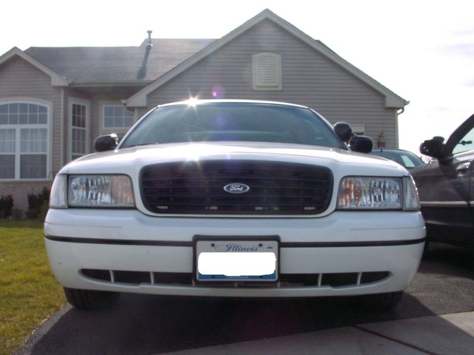 White 1999 Ford Crown Victoria front view with Illinois license plate
